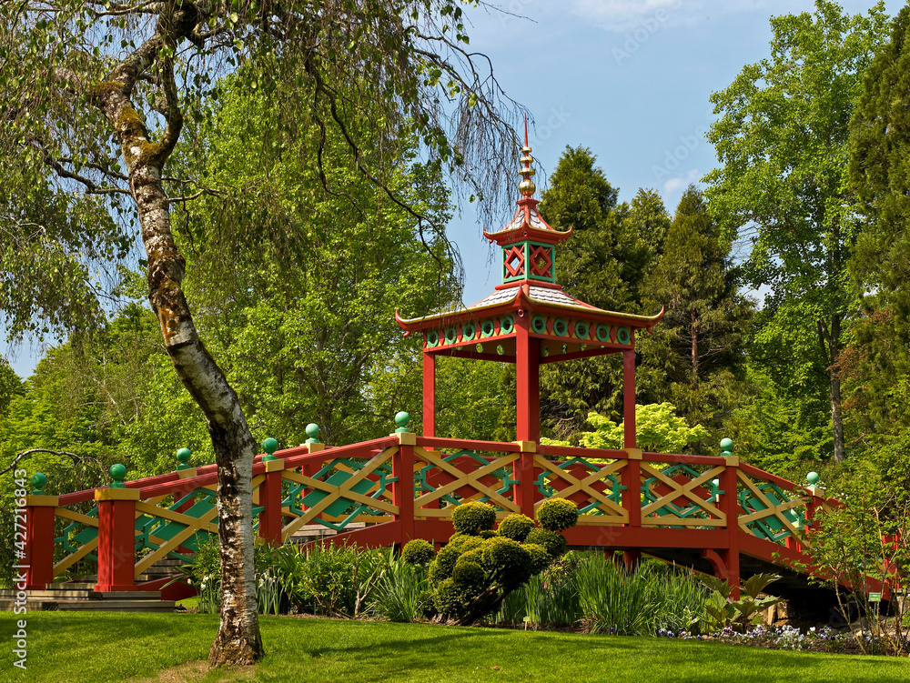 The colourful Chinese Bridge in the parkland over the lake at Apremont in the Loire Valley France The colourful Chinese Bridge in the parkland over the lake at Apremont in the Loire Valley France