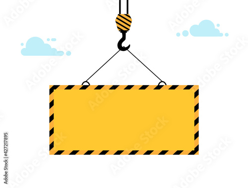 Yellow warning sign lowers crane on winch. Warning sign with blank space for text.