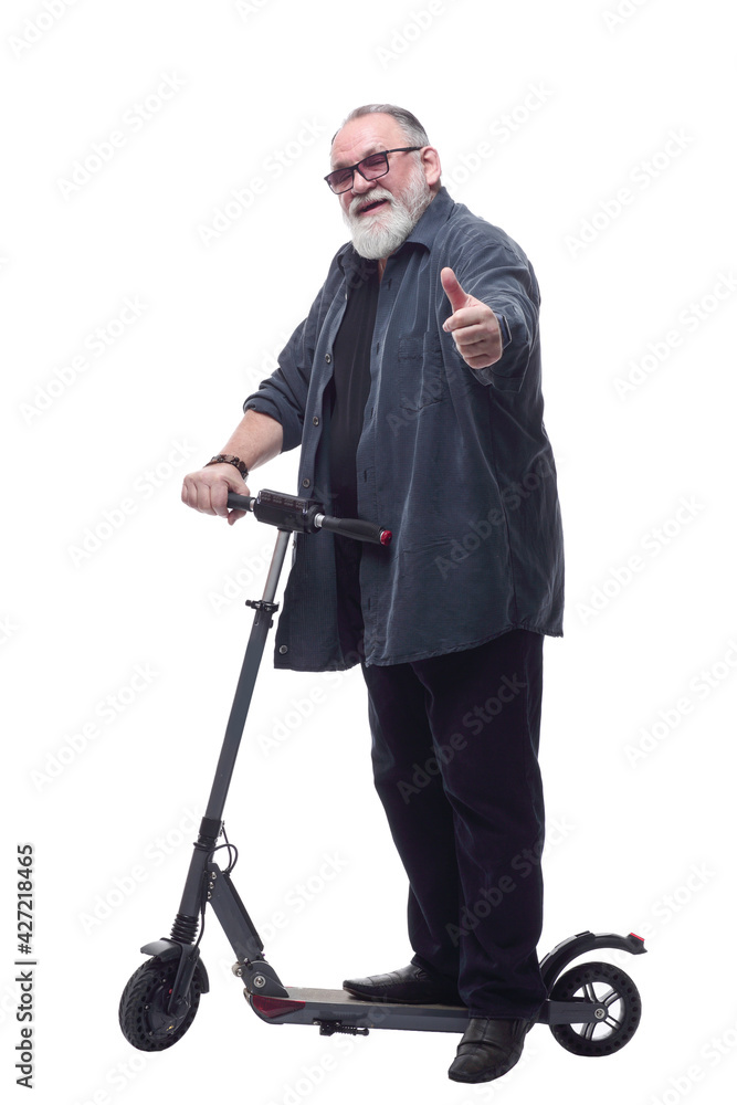 bearded man with an electric scooter looking at you. bearded man with an electric scooter looking at you.