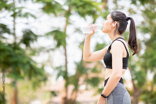 Women's Health Concept,Asian young woman exercise and running ,making fitness workout at park 