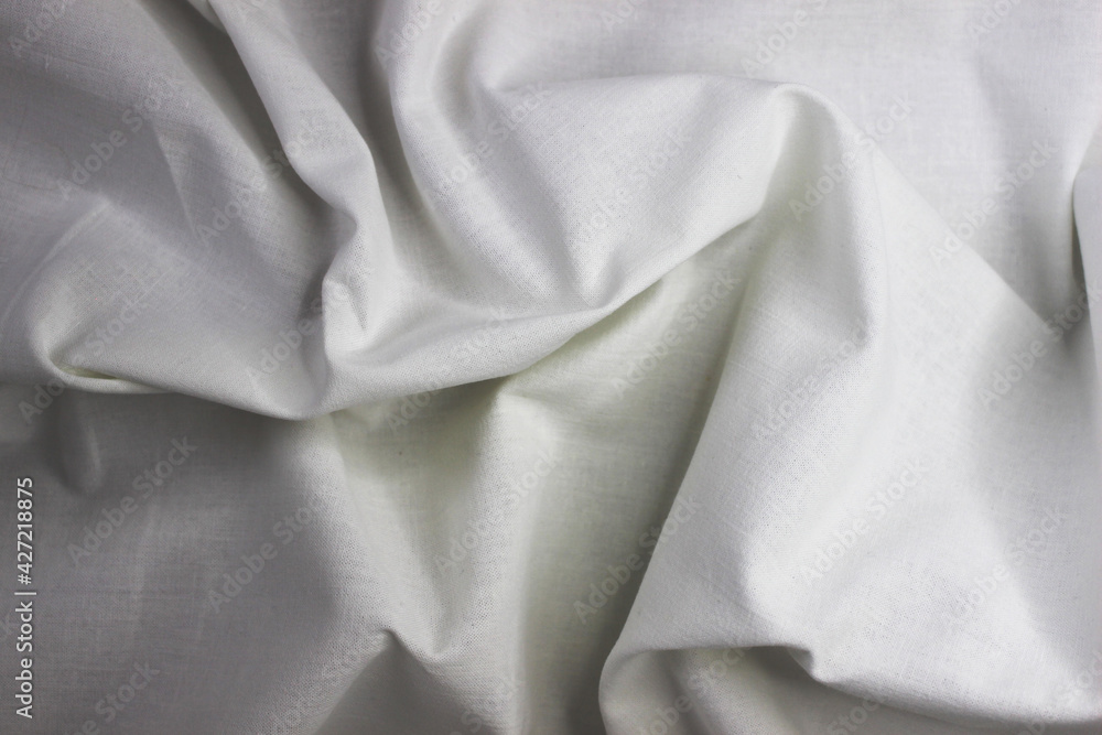 White cotton fabric texture where light and shadow are clearly visible White cotton fabric texture where light and shadow are clearly visible