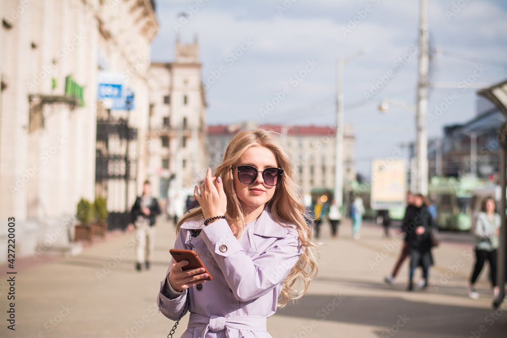 Fototapeta premium Lifestyle concept, a beautiful girl in the city walks