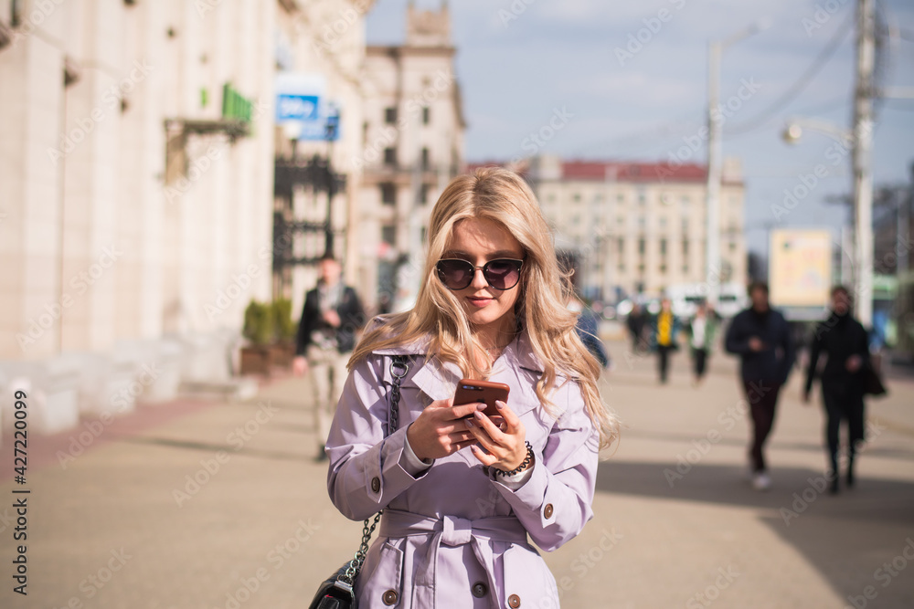 Fototapeta premium Lifestyle concept, a beautiful girl in the city walks