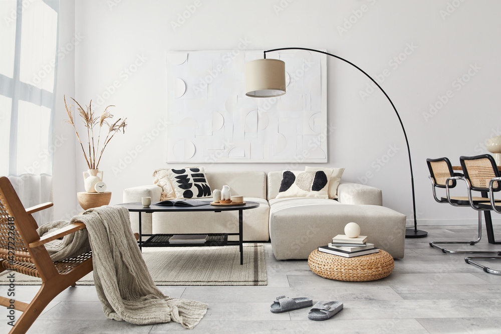 Obraz premium Domestic interior of living room with design modular sofa, black coffee table, lamp, armchair, decoration, art paintings and elegant personal accessories in modern home decor. Template.