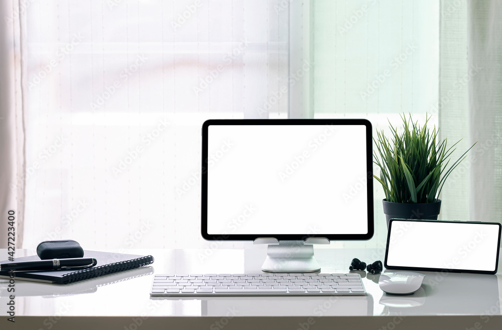 Home office setup with tablet and smartphone on the table. Home office setup with tablet and smartphone on the table.
