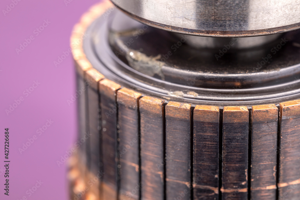 Copper commutator bar of the electric motor close up. Electric motor rotor. Copper commutator bar of the electric motor close up. Electric motor rotor.