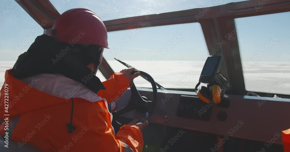 Close up of coast guard team sailing rescue boat in arctic Close up of coast guard team sailing rescue boat in arctic
