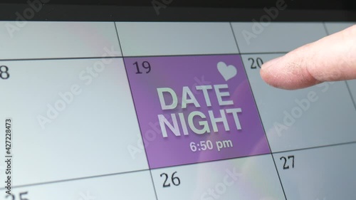 Date Night Written on Calendar Date as Reminder Closeup photo
