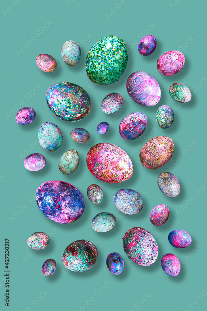 Levitation of bright shiny eggs on a green background. Levitation of bright shiny eggs on a green background.