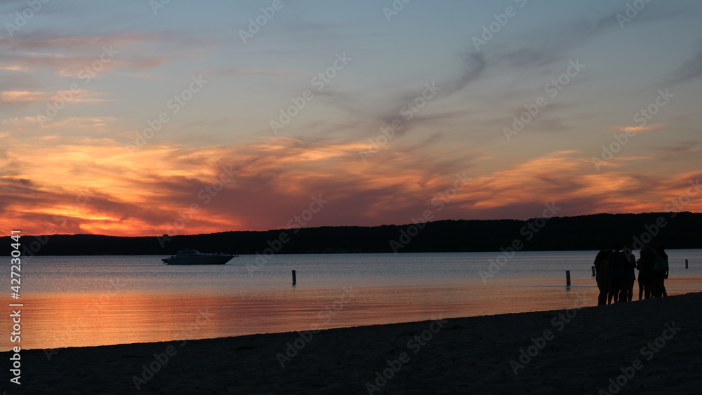 People watching the sunset on the beach Michigan People watching the sunset on the beach Michigan