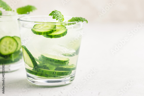 Mint cucumber iced cocktail. Space for text.