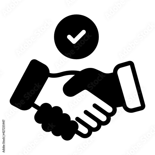 
Handshake with tick showing the concept of commitment 

