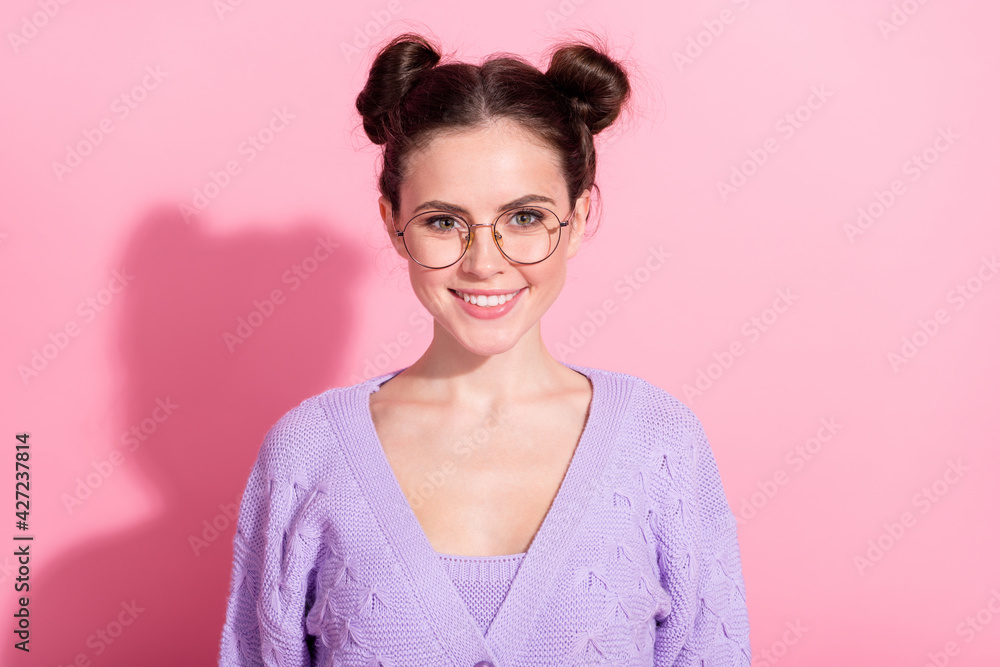 Photo portrait of pretty girl wearing purple cardigan smiling in glasses isolated on pastel pink color background Photo portrait of pretty girl wearing purple cardigan smiling in glasses isolated on pastel pink color background