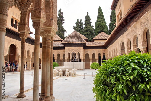 Patio of the Lions is a famous courtyard in the middle of the Lion Palace of the Nasrid dynasty in the Alhambra residence.