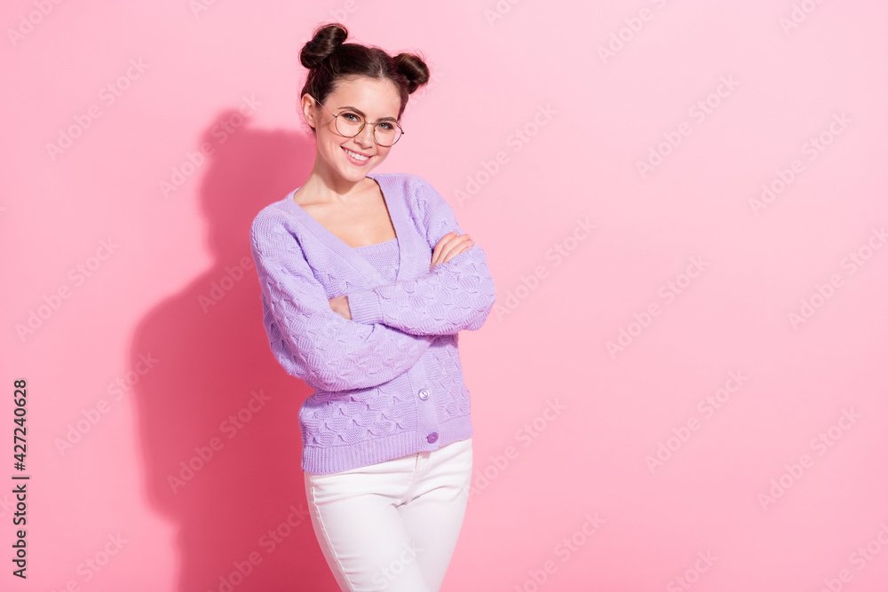 Photo portrait of model in glasses wearing stylish violet cardigan smiling crossed hands isolated on pastel pink color background Photo portrait of model in glasses wearing stylish violet cardigan smiling crossed hands isolated on pastel pink color background