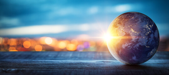 Planet earth on the background of blurred lights of the city. Concept on business, politics, ecology and media.  Elements of this image furnished by NASA