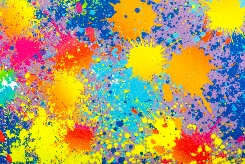 Many colored blots from paint on fabric as background, texture, pattern.