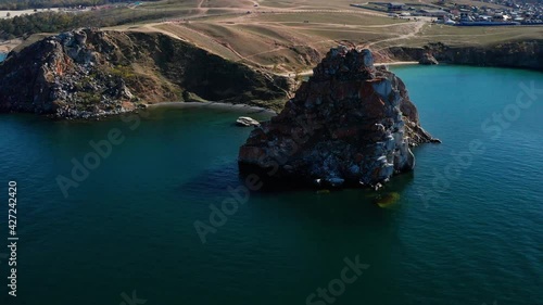 Lake Baikal in autumn. Cape Burkhan, Shamanka rock on the Olkhon island. Aerial view. photo