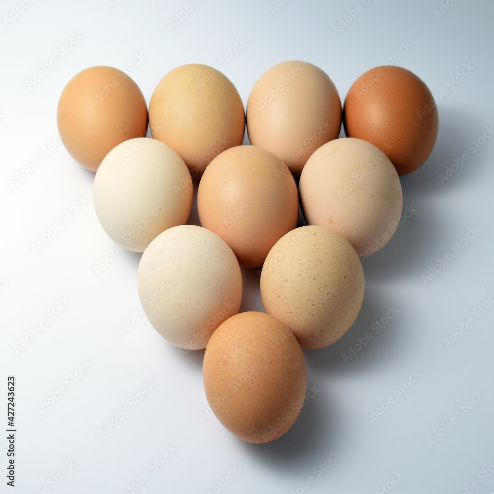 Eggs on white background with triangle shape Eggs on white background with triangle shape