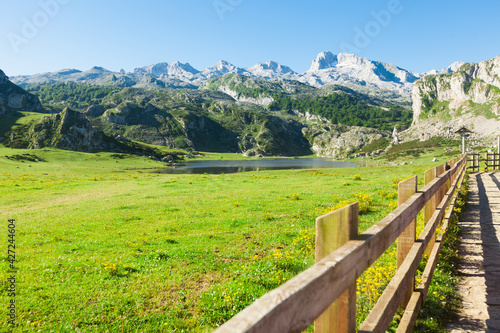 view with a wooden walkway to national park peaks of europe