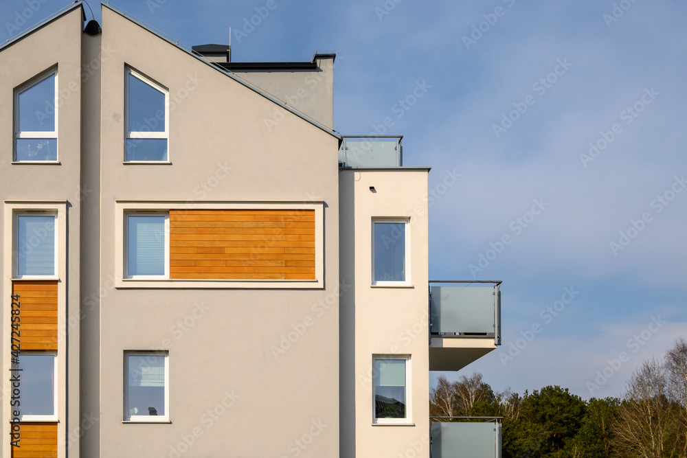 Obraz premium Modern apartment block in a housing estate. Architecture contemporary