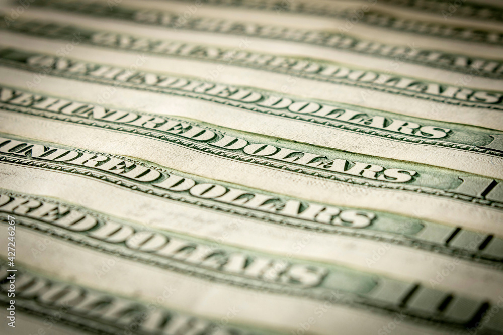 Abstract background of hundred-dollar bills. Selective focus. Abstract background of hundred-dollar bills. Selective focus.