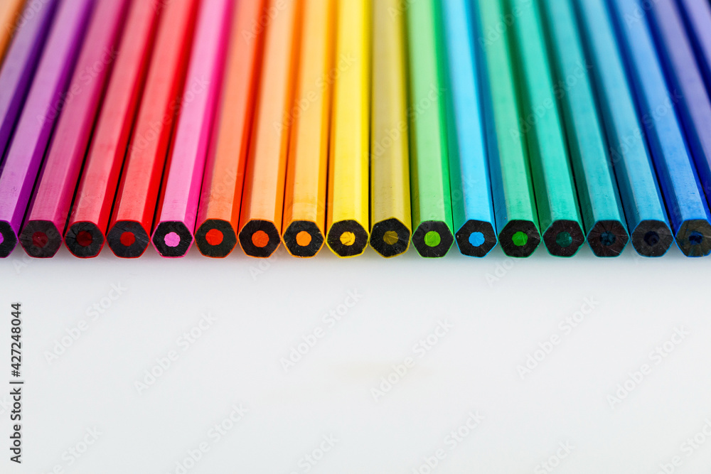 Set of colored pencils on white table Set of colored pencils on white table
