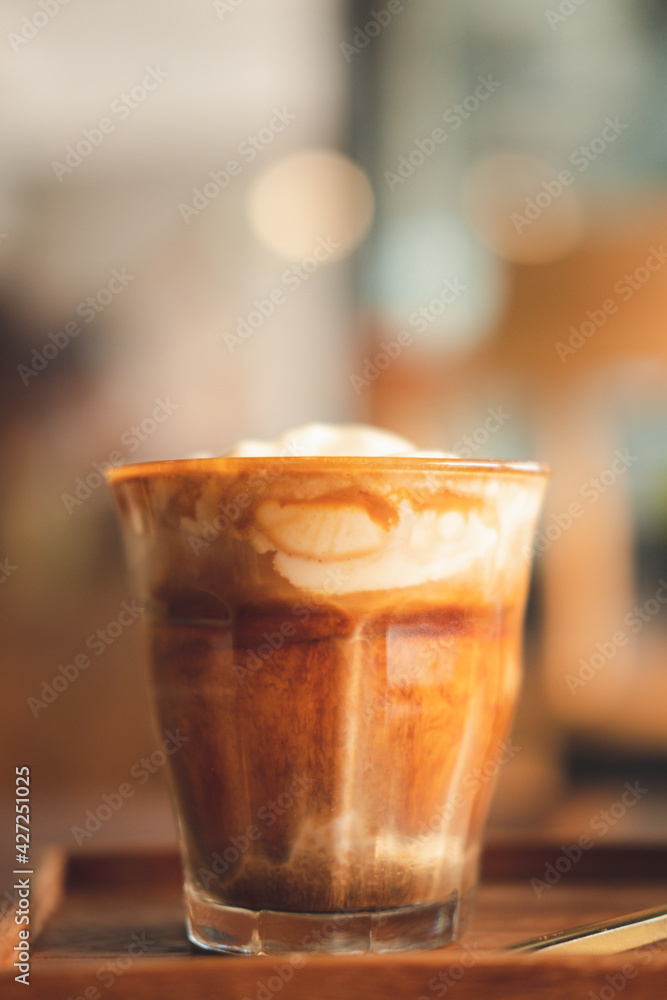 Coffee with ice cream in shot glass Coffee with ice cream in shot glass
