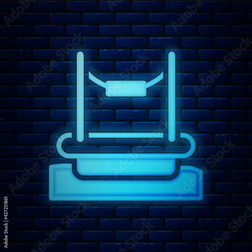 Glowing neon Bungee trampoline attraction with metal ladder icon isolated on brick wall background. Vector