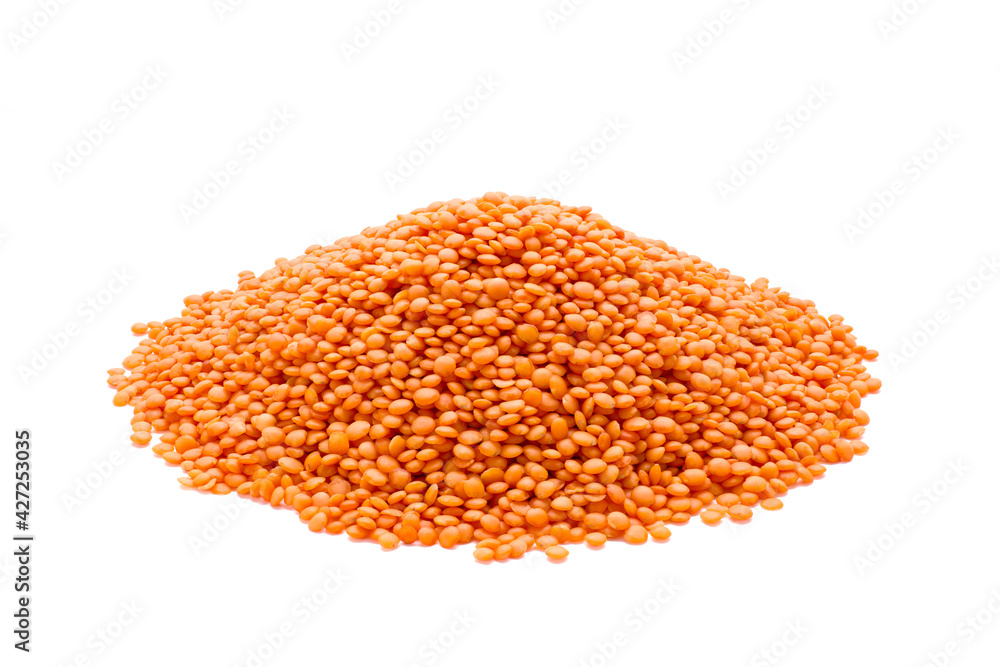 Heap of red lentils not cooked isolated on white background
