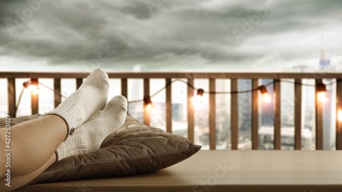 Woman legs with socks and window background 