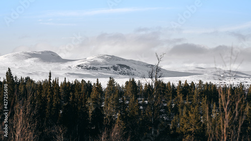 Landscape of the winter mountains in Ål, Hallingdal, Norway. Shot in April in the evening. Summer is coming, but the snow is still covering the mountains. 