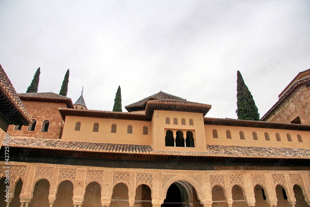 it a view of Patio of the Lions, the famous courtyard in the middle of the Nasrid Palace in the Alhambra residence.