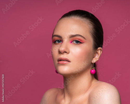 High beauty photo of a lovely young girl with wonderful professional makeup