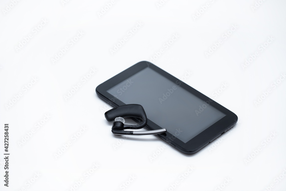 Black tablet and Wireless ear buds earbuds Black tablet and Wireless ear buds earbuds