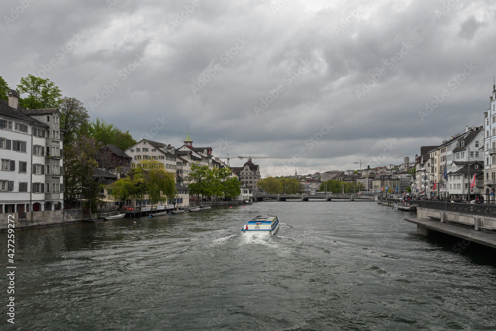 Tourist boat on the Limmat river in Zurich, Switzerland