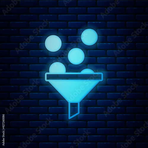 Glowing neon Lead management icon isolated on brick wall background. Funnel with money. Target client business concept. Vector