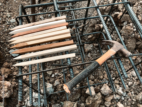 pulling nine lucky nine race of strong wood on soil before construction building photo