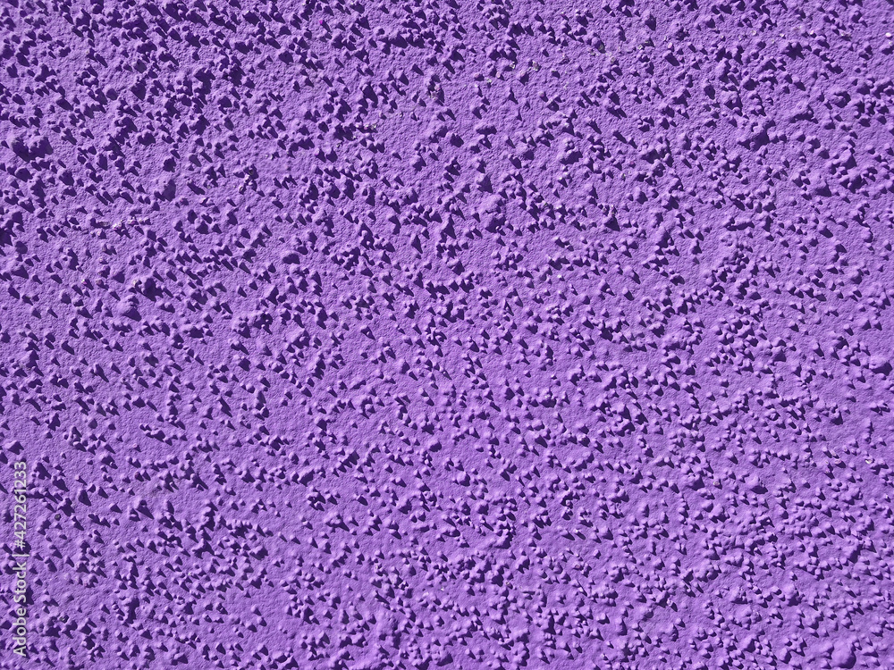 textured colored facing plaster of the street wall of the building textured colored facing plaster of the street wall of the building