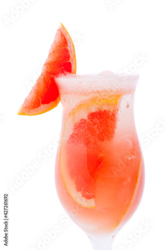 Close up of cocktail glass of grapefruit juice with peaces of grapefruit inside, isolated
