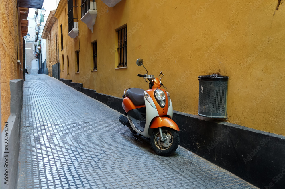 Motorbike in the narrow street of European town
