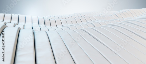 White wavy patterns with a light in the background closeup, wallpaper design concept. 3d rendering