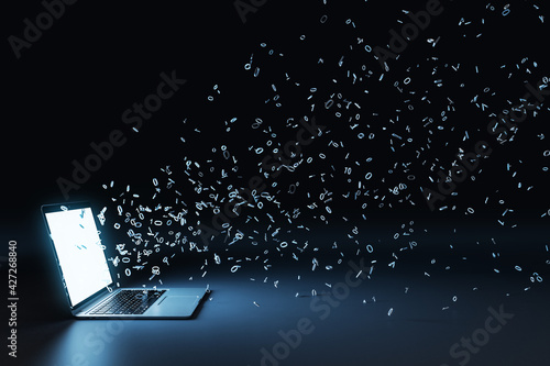 Quadro su tela Laptop with multipe particles flow coming out from the glowing white screen on a black background