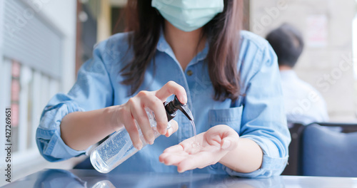 woman use hand sanitizer gel photo