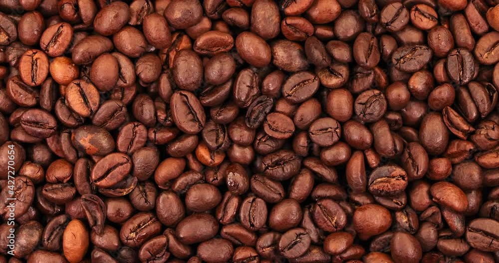 coffee beans rotate. Coffee Super slow motion coffee beans rotate. Coffee Super slow motion