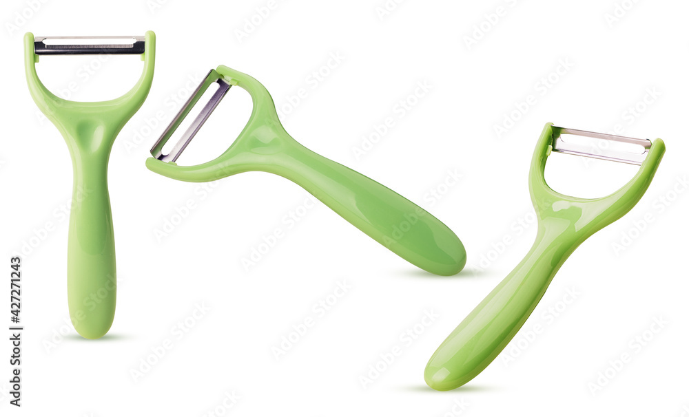 Set green vegetable peelers close up Set green vegetable peelers close up