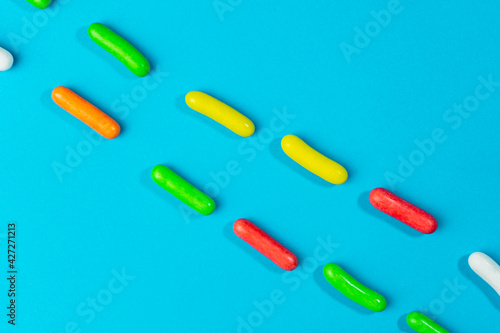 Colorful candies and sweets .Multicolored sugar sprinkles background.Creative Top view.