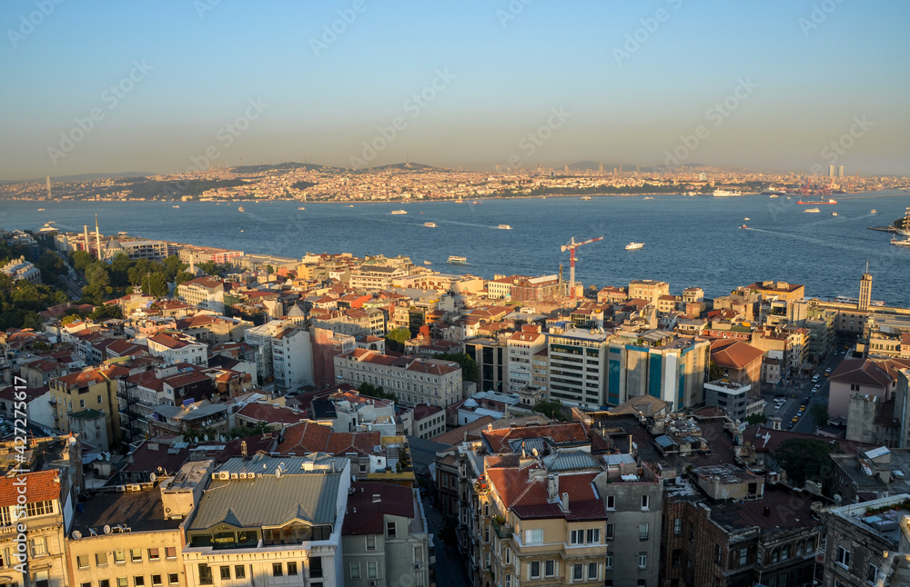 Scenic view on sunset sky from Galata Tower over Bosphorus, Beyoglu and Besiktas districts, towards Bosporus Bridge in Istanbul, Turkey 