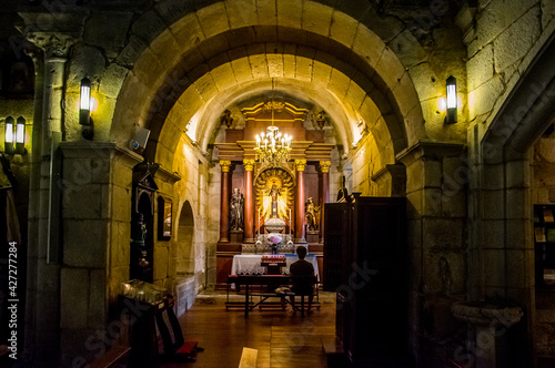 Interior de la cabecera de una iglesia románica española, con su particular luz íntima que invita al recogimiento, la fe y la oración photo