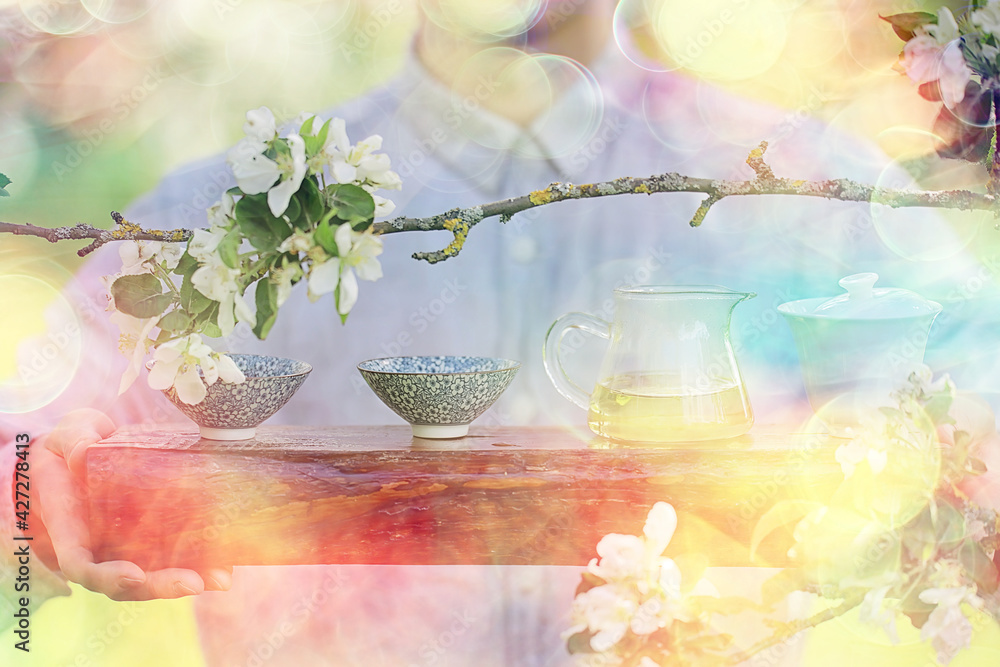 spring tea ceremony in asia, abstract fresh garden background man master